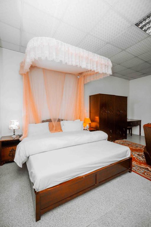 Bedroom with orange canopy